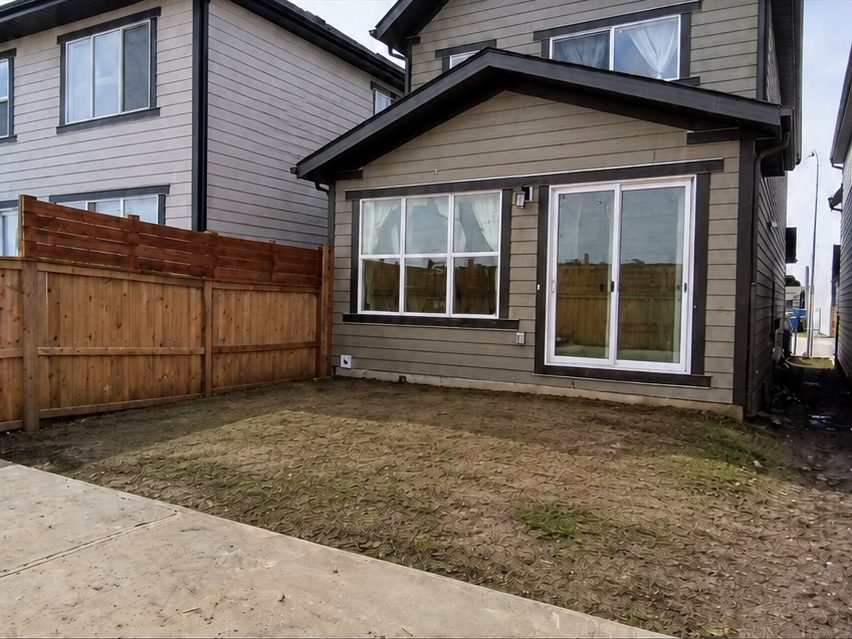 Concept visualization: the same backyard before construction, bare grade and a concrete walkway